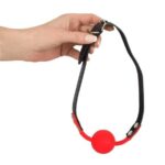 Bad Kitty - silikónová ústna páska s pútkom z koženky (červená) od značky Bad Kitty